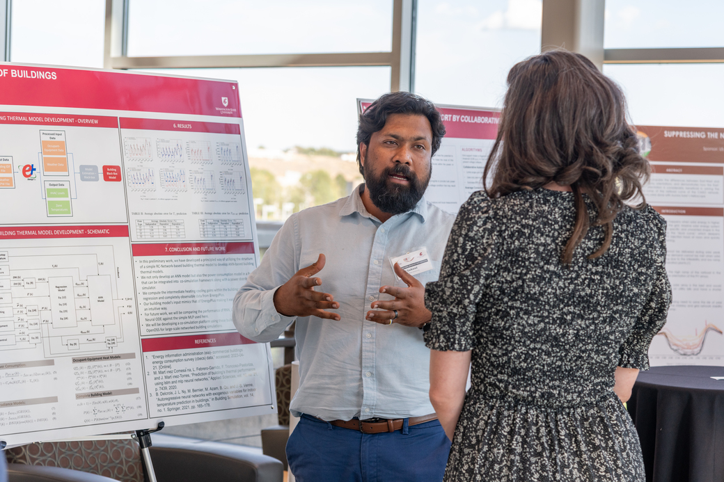 Ninad Gaikwad presenting research at a technical poster session